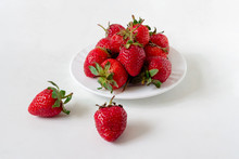 Strawberries In A White Plate