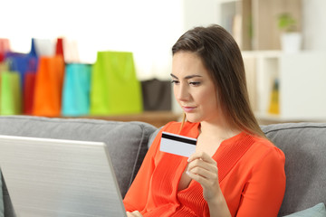 Poster - Lady paying online with a credit card and a laptop