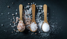 Different Types Of Salt. Top View On Three Wooden Spoons