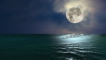 Animated Video Showing A Low, Full Moon Glistening Over The Ocean With Beautiful Reflections Off The Water's Surface At Night.
