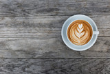 Fototapeta Kawa jest smaczna - A cup of cappuccino with latte art