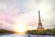 © Kotkoa - Romantic sunset background. Eiffel Tower with boats on Seine river in Paris, France.