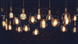 Leinwandbild Motiv Beautiful vintage luxury light bulb hanging decor glowing in dark. Retro filter effect style.