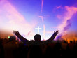 © paul - Church worship concept:Christians raising their hands in praise and worship at a night music concert