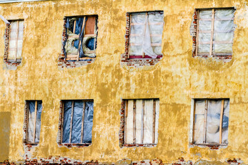 Wall Mural - Boarded up, dirty, wood window in an abandoned ruined house