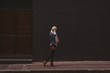 © Wavebreak Media - Hijab woman talking on mobile phone while walking on sidewalk