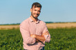 © Zoran Zeremski - Portrait of young farmer in soybean filed.