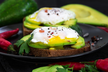 Wall Mural - Toasts with avocado and poached eggs