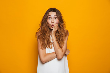 Wall Mural - Portrait of a shocked young girl looking at camera