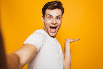 Sticker - Portrait of a happy young man taking a selfie