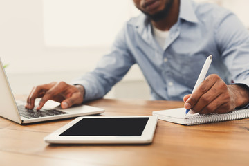 Poster - African-american businessman working on tablet