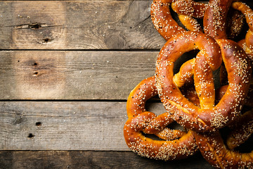 Poster - Oktoberfest concept - pretzels on rustic wood background