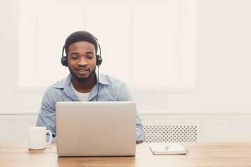 Wall Mural - Call center operator man with headset working