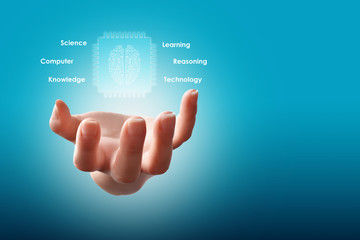 Artificial intelligence concept (AI), hand holding digital brain inside chip, surrounded with conceptual text messages on blue background with free space