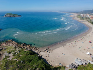 Wall Mural -  Aerial view of Brazilian beach with white sand, blue sea, and harbor.