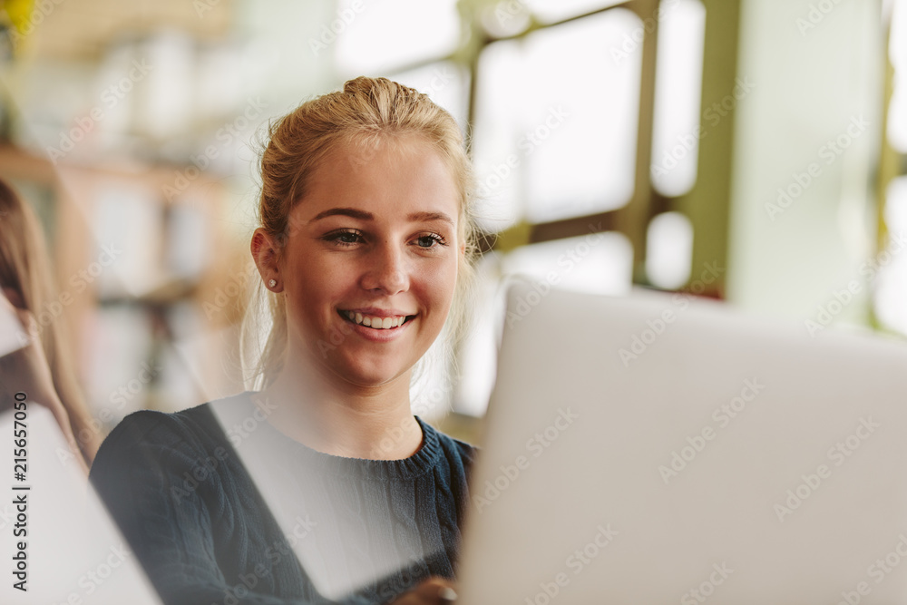 Study In Girl Girl studying with laptop in university class Stock Photo | Adobe Stock