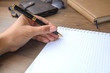 © miztanya - Woman (girl, bussineswoman) hand with pen writing on notebook.