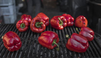 Red sweet peppers cooking on the grill. Healthy vegetarian Meal.