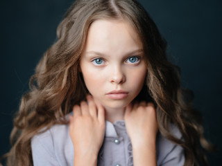 Wall Mural - girl with curls with blue eyes portrait