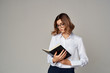 © SHOTPRIME STUDIO - business woman with notepad on gray background