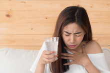 Choking Woman While Drinking Water; Home Danger, Health Insurance, Choking Hazard Concept; Young Adult Asian Persian Woman Or Asian Middle East Woman Model