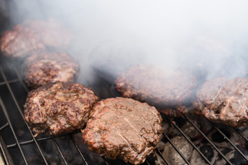 Wall Mural - Flame Broiled Hamburgers On Grill, Seasonal Cookout 