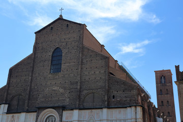 BOLOGNA, ITALY - JULY 20, 2018: Facade of the Basilica of San Petronio in Piazza Maggiore. The sixth largest church in Europe. The building was laid in 1390
