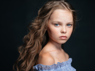 Wall Mural - girl with curls portrait