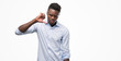 © Krakenimages.com - Young african american man wearing a shirt with angry face, negative sign showing dislike with thumbs down, rejection concept