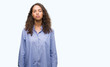 © Krakenimages.com - Young hispanic business woman with serious expression on face. Simple and natural looking at the camera.