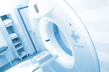 Wall Mural - CT scan machinery with empty bed in the hospital room