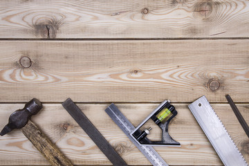 woodwork tool set on a wood background. top view