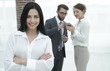 © ASDF - close-up of a beautiful woman manager and co-workers in the office