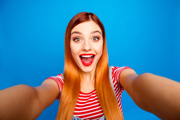 Hey how are you there! Close up studio photo portrait of pretty funny funky cute surprised shocked with open mouth lady taking making selfie isolated bright shinny vivid background