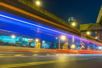 the light trails on the modern building background.