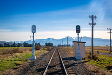 Lights Signal Green On The Railway Line Towards The Alpine Pass In The Countryside