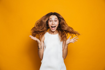 Wall Mural - Portrait of a positive young girl screaming