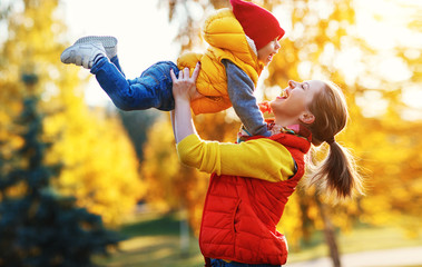 Sticker - y family  mother   and baby son on   autumn walk