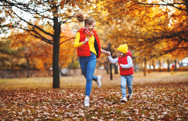 Wall Mural - happy family mother and child daughter on   autumn walk