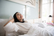 © Danai - Cheerful woman wake up with fresh feeling in clean bedroom