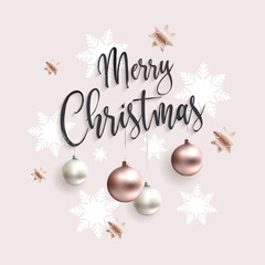 Xmas card with rose gold balls. Merry christmas calligraphic inscription ornate toys. Pink clean background. Golden xmas balls.