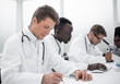 © ASDF - group of doctors working in the hospital laboratory