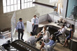 © Monkey Business - Businessman giving presentation to colleagues, elevated view