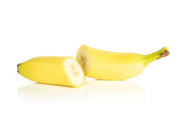 Wall Mural - Group of two halves of fresh yellow banana isolated on white background