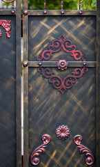 wrought-iron gates, ornamental forging, forged elements close-up