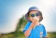 © candy1812 - Happy child eating ice cream outdoors in summer