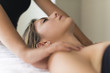 © Minerva Studio - Young woman having a massage in a spa