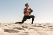 © Jacob Lund - Man training at the beach using a medicine ball
