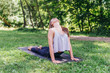 © Luis Velasco/Stocksy - Beautiful Girl Doing her Yoga Session in the Park.