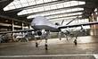 Military Drone UAV aircraft's with ordinance in position in a hangar awaiting a strike mission. 3d rendering